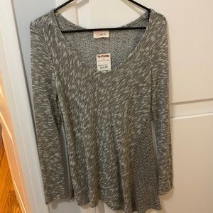 NWT asymmetrical sparkly silver sweater with back detail size small